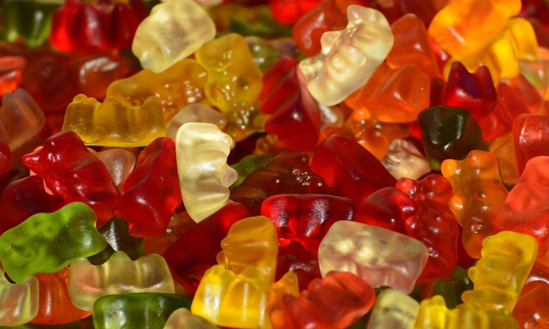 A pile of colorful gummy bears, ready for bottling.